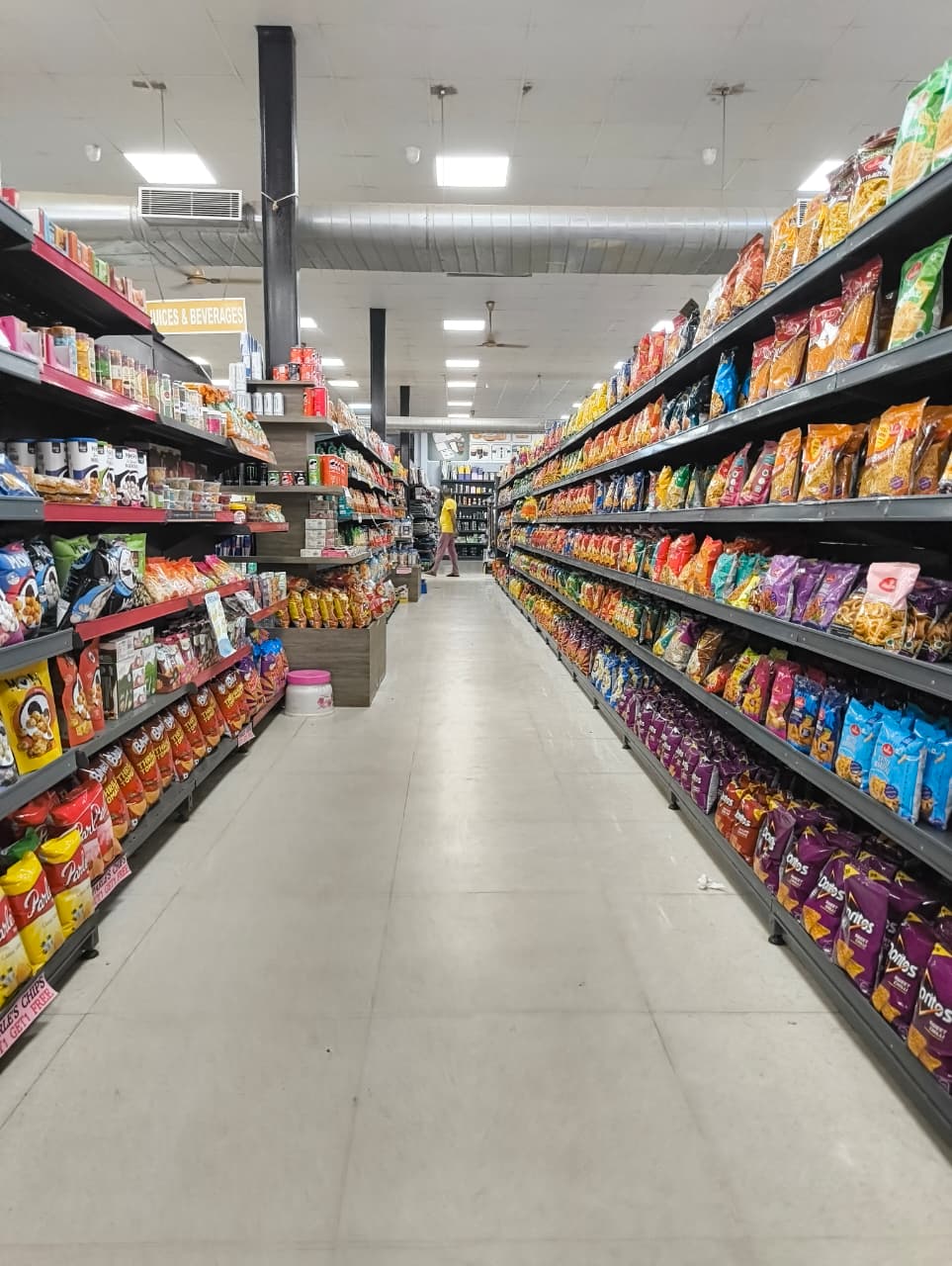 Wide aisle with snacks and packaged goods